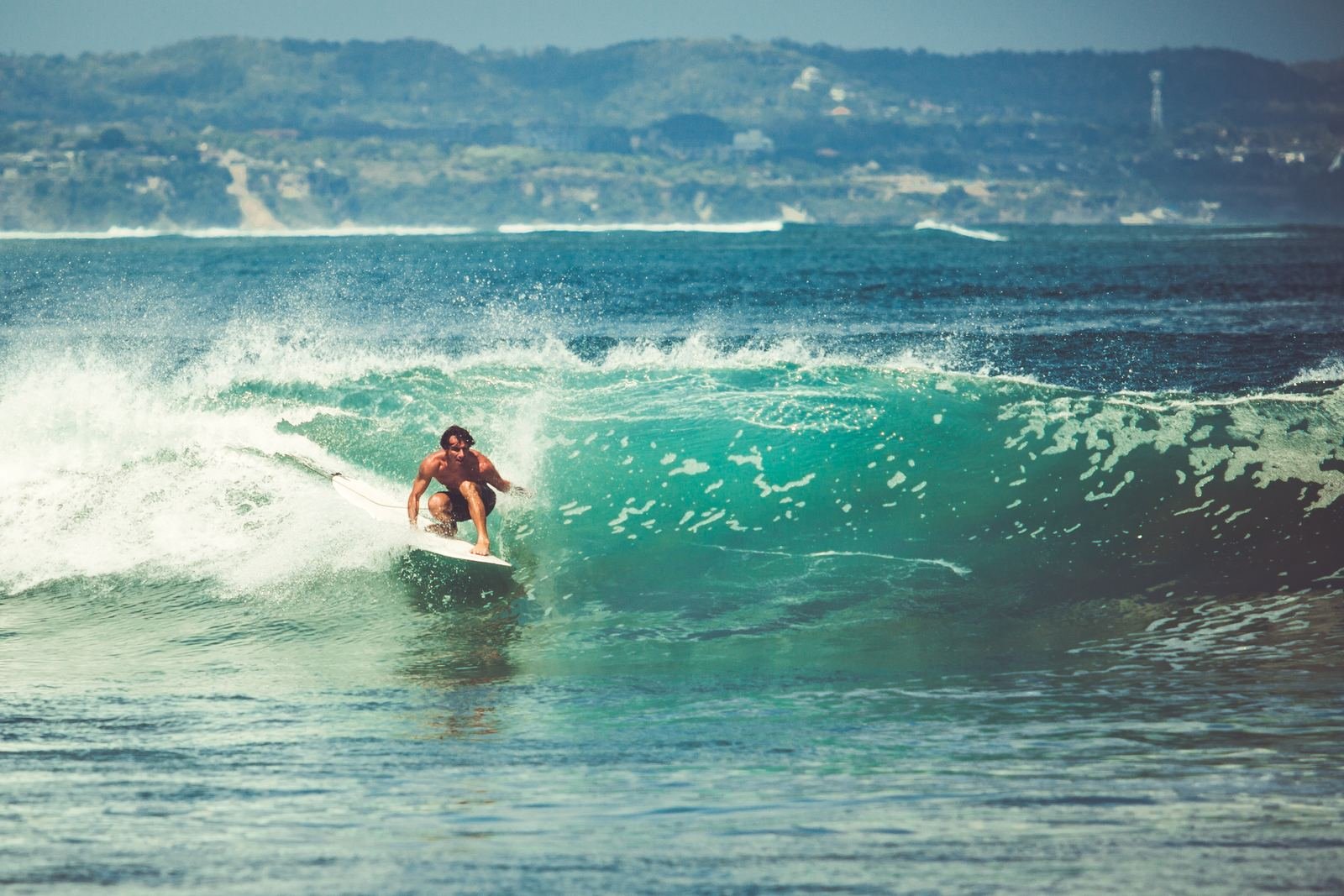 A surfer riding a wave on the Portuguese coast
